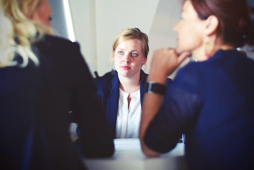 criminal defence lawyer sitting with clients