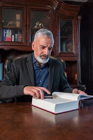 Virk Barrister reading a legal book